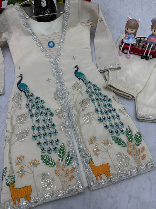 Detailed view of embroidered threadwork, sequins, and beaded lace on cream shimmer tissue silk fabric

