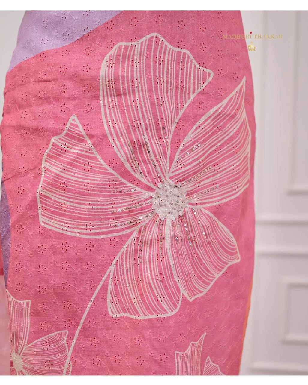 Close-up of floral embroidery design on Pink Shifli Linen suit