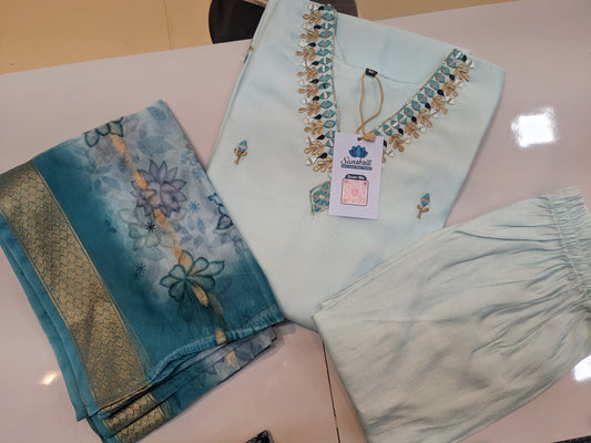 "Sky blue Roman silk suit with organza dupatta displayed on mannequin"

"Flat lay of embroidered kurta, pants, and printed dupatta